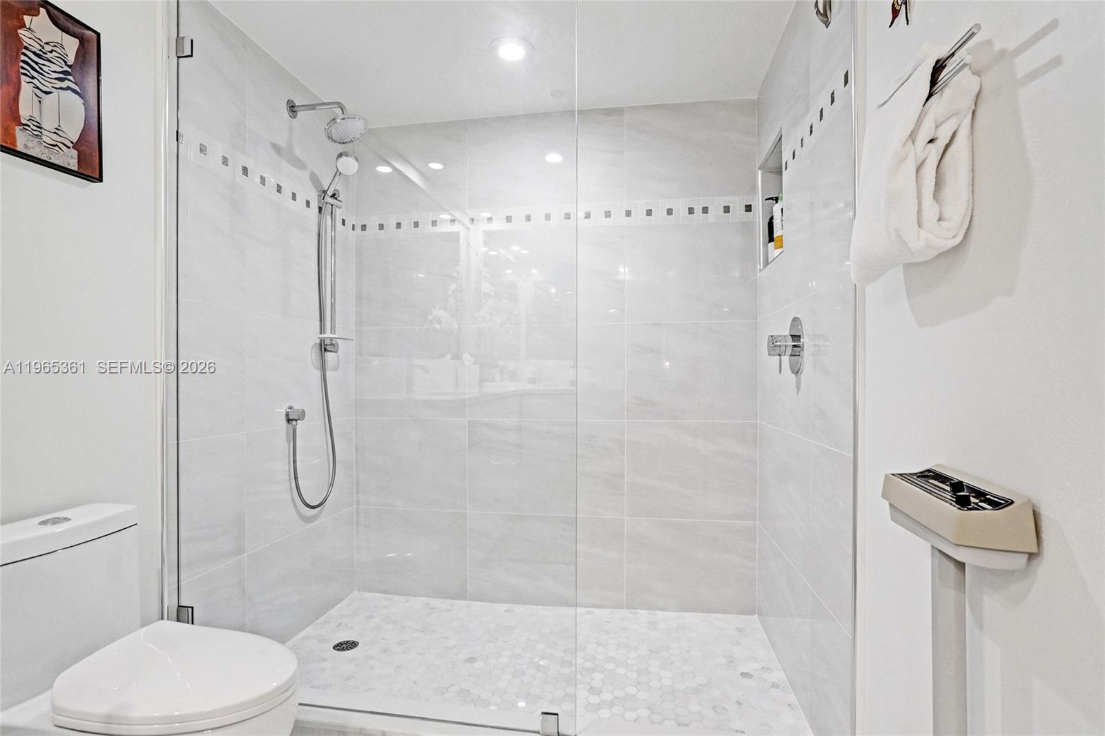 501 North Riverside Drive, Unit 802 Pompano Beach, FL 33062 - Photo 30 of 70 a bathroom with a shower a toilet and sink
