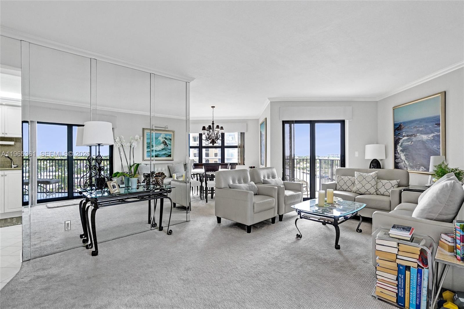 501 North Riverside Drive, Unit 802 Pompano Beach, FL 33062 - Photo 3 of 70 a living room with furniture and a table