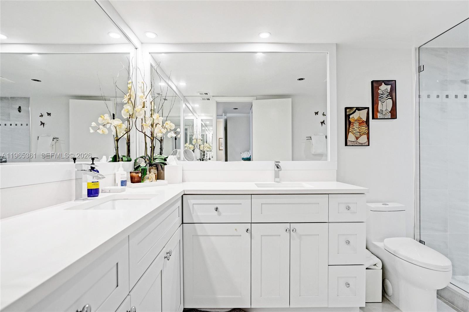 501 North Riverside Drive, Unit 802 Pompano Beach, FL 33062 - Photo 31 of 70 a bathroom with a sink a toilet and a mirror