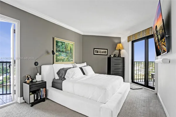 a bathroom with a sink a mirror and a shower