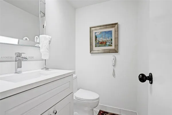 a view of a hallway with wooden shelves
