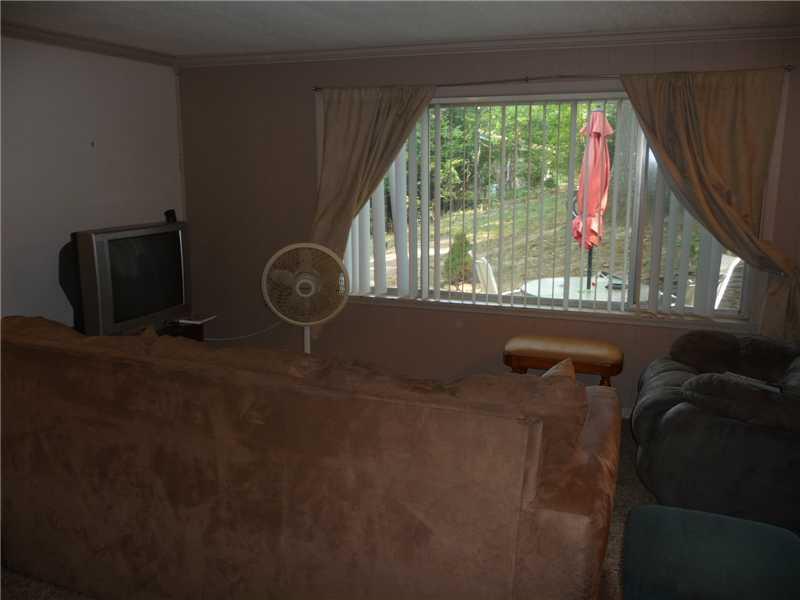 80 Simon Road Cheswick, PA 15024 - Photo 18 of 23 Living Room. Large window in the living room gives you a veiw of the yard