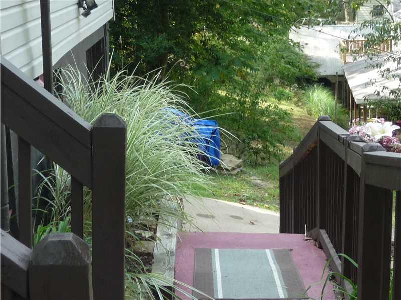 80 Simon Road Cheswick, PA 15024 - Photo 9 of 23 View. View down walkway from front porch to the driveway and garage