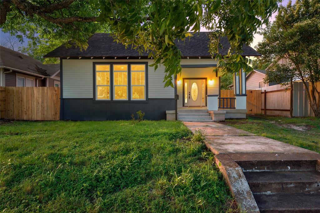 2023 Bosque Boulevard Waco, TX 76707 - Photo 1 of 26 Charming bungalow exterior featuring a covered front porch, white-paneled front door with oval glass insert, and multi-pane windows