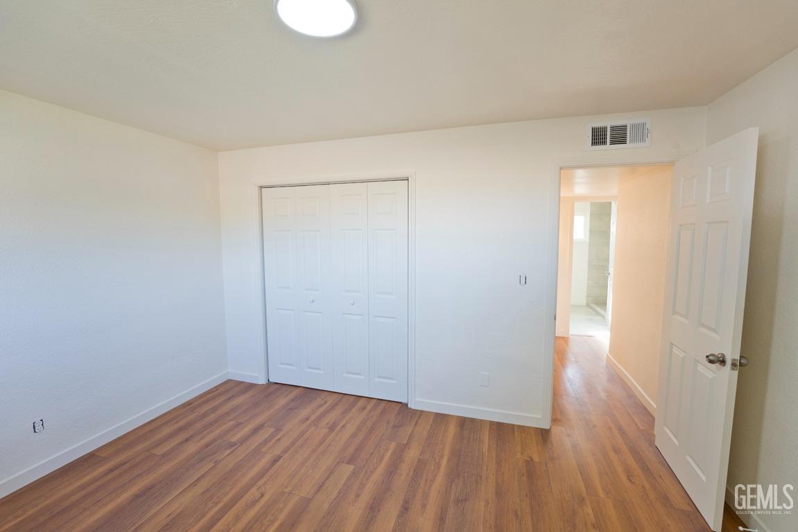 Undisclosed Address Bakersfield, CA 93308 - Photo 14 of 23 a view of a room with wooden floor