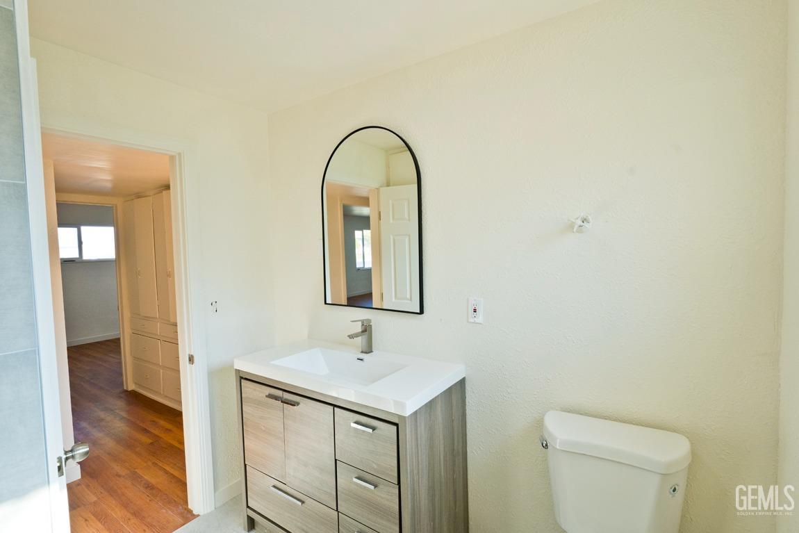 Undisclosed Address Bakersfield, CA 93308 - Photo 15 of 23 a bathroom with a sink and a mirror