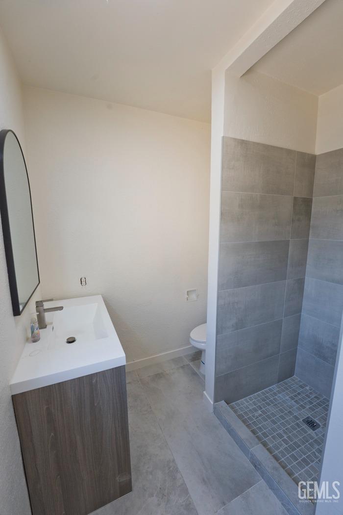 Undisclosed Address Bakersfield, CA 93308 - Photo 19 of 23 a bathroom with a sink a toilet and shower