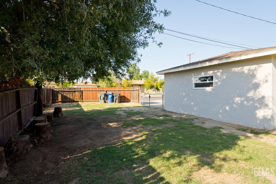 Undisclosed Address Bakersfield, CA 93308 - Photo 23 of 23 a backyard of a house with lots of green space