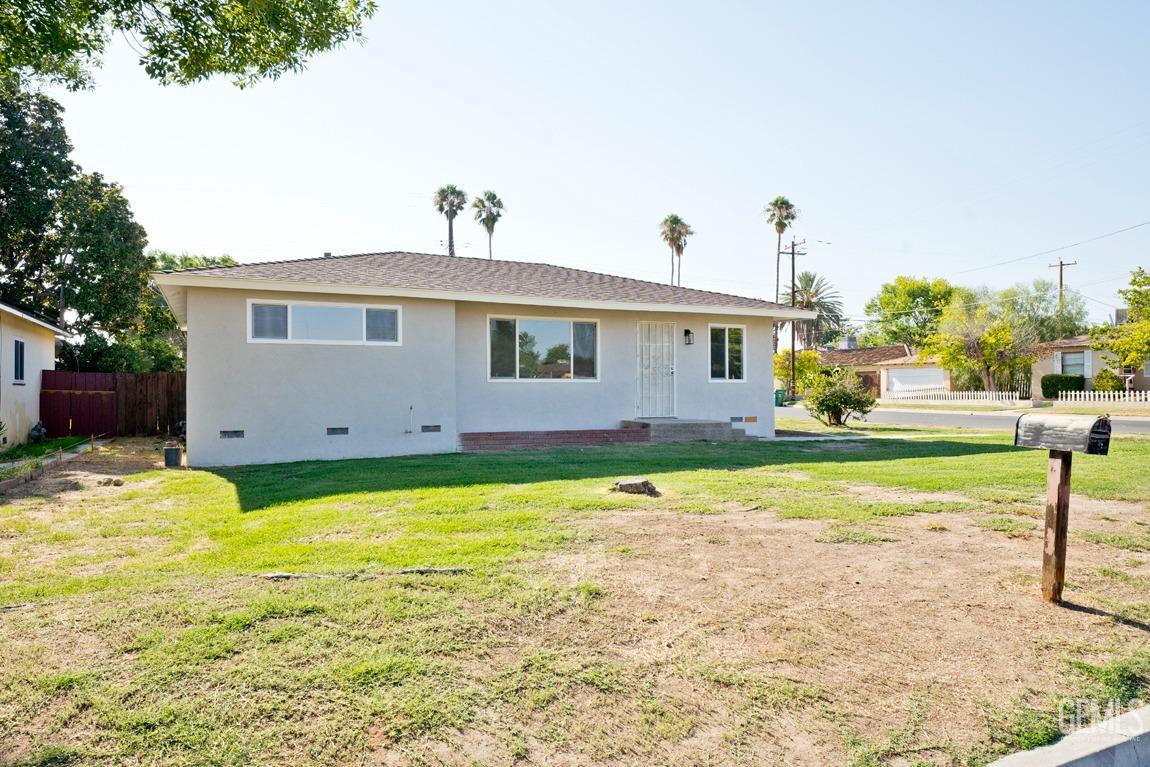 Undisclosed Address Bakersfield, CA 93308 - Photo 4 of 23 a front view of house with yard and garage