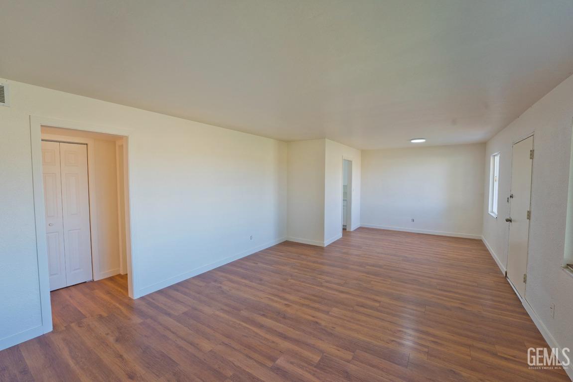 Undisclosed Address Bakersfield, CA 93308 - Photo 5 of 23 a view of an empty room and wooden floor