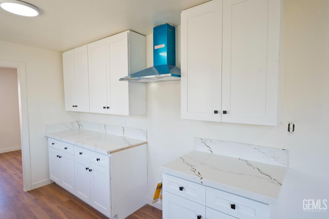 Undisclosed Address Bakersfield, CA 93308 - Photo 10 of 23 a bathroom with a sink and vanity