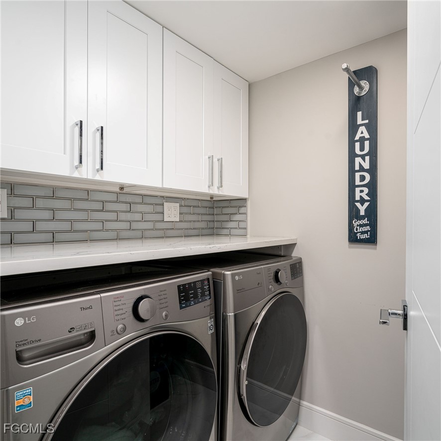 17 Bluebill Avenue, Unit 903 Naples, FL 34108 - Photo 21 of 33 a utility room with dryer and washer