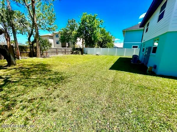 a view of swimming pool with a yard