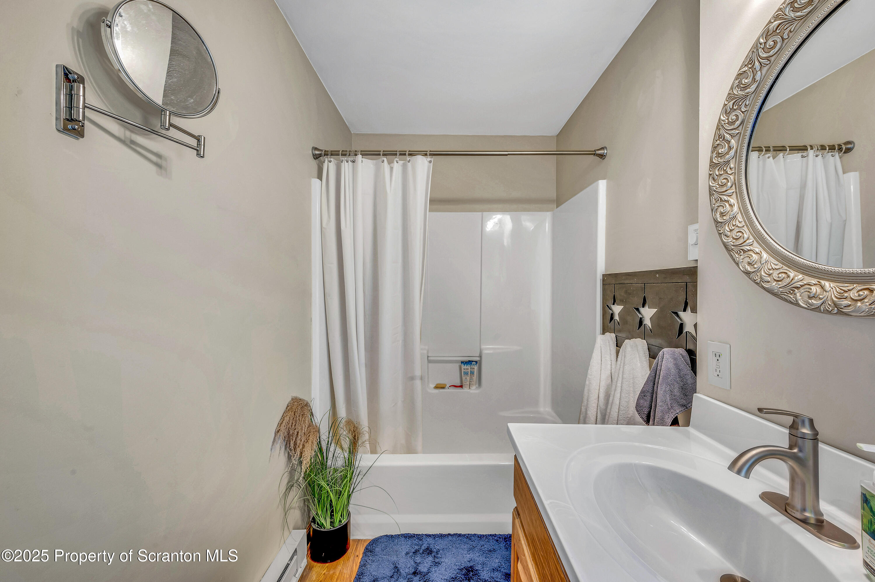 5115 State Rte 3013 Springville, PA 18844 - Photo 47 of 74 a bathroom with a sink a toilet and a mirror