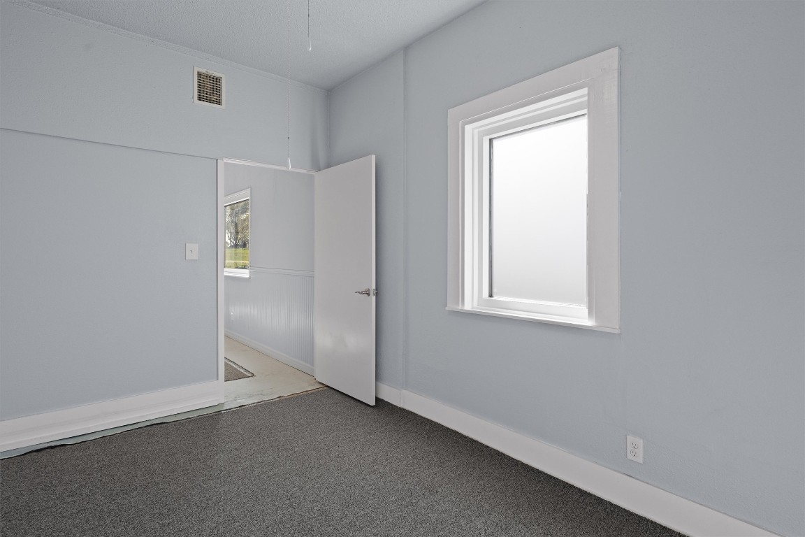 1102 Beech Street Taylor, TX 76574 - Photo 22 of 40 an empty room with a window