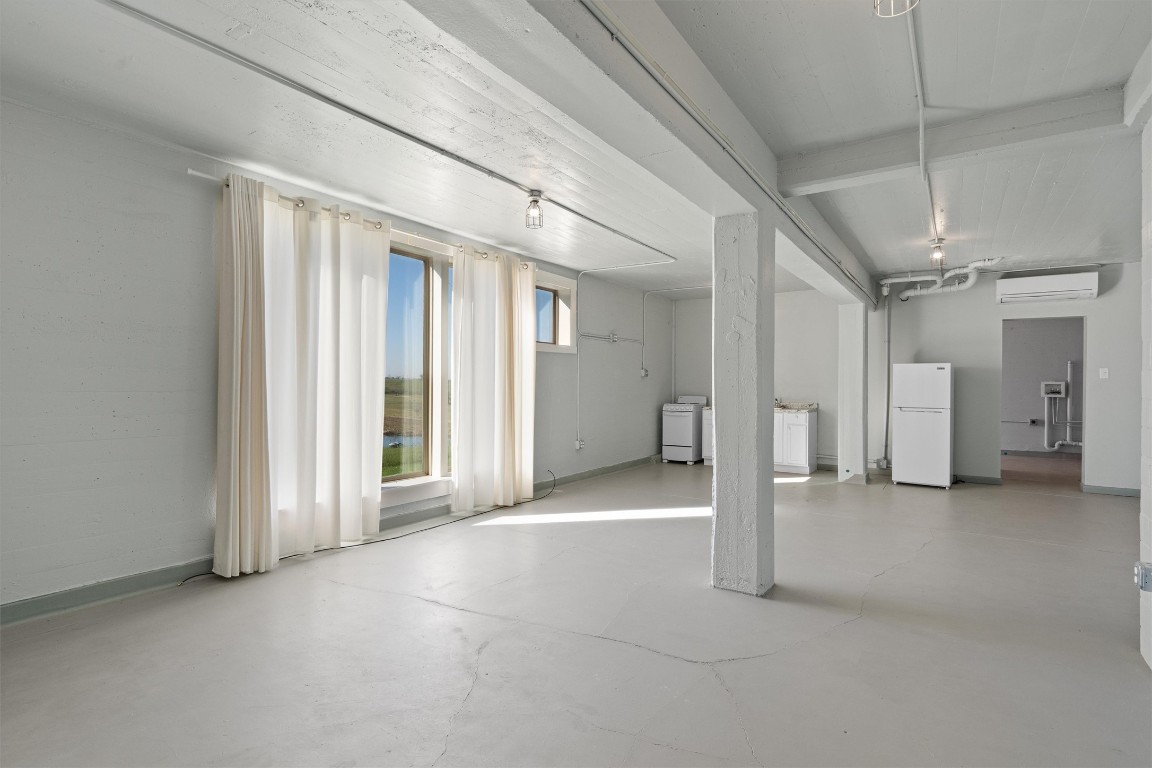 1102 Beech Street Taylor, TX 76574 - Photo 24 of 40 a view of empty room with wooden floor