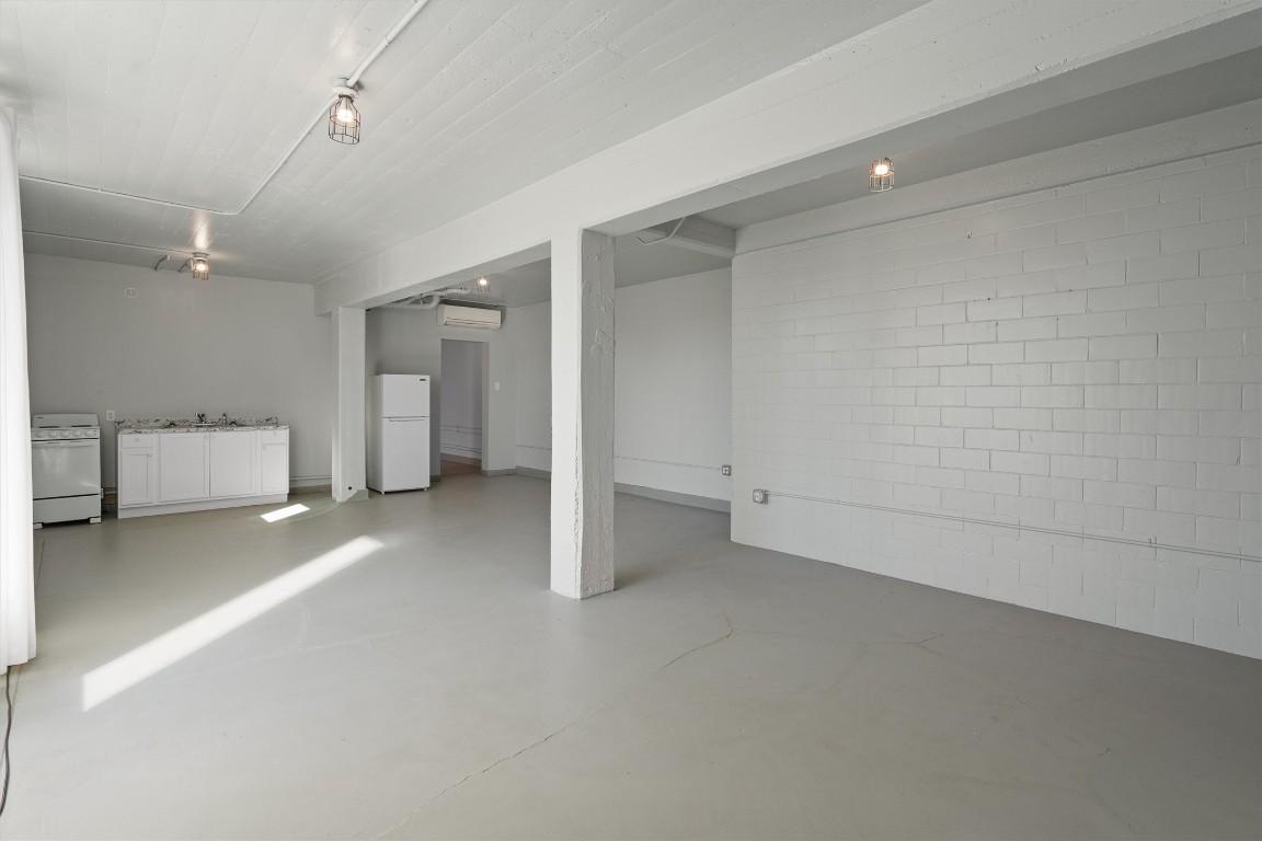 1102 Beech Street Taylor, TX 76574 - Photo 25 of 40 an empty room with a cabinet and mirrors