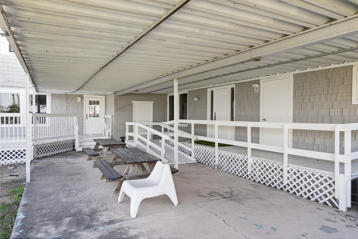 1102 Beech Street Taylor, TX 76574 - Photo 37 of 40 a balcony with furniture and wooden fence