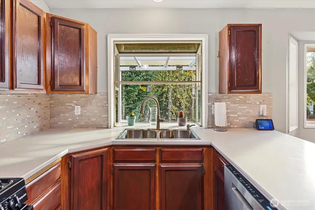 a kitchen with a sink and a window