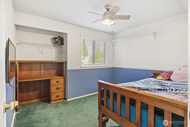 a bedroom with furniture and a chandelier