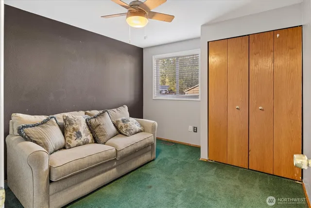 a living room with furniture and a window