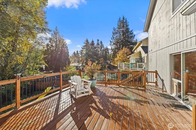 a view of a house with wooden deck
