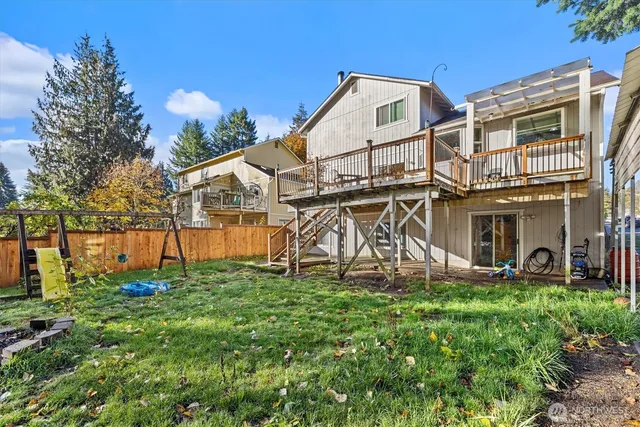 a view of a front of a house with a yard