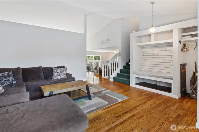 a living room with furniture and a rug
