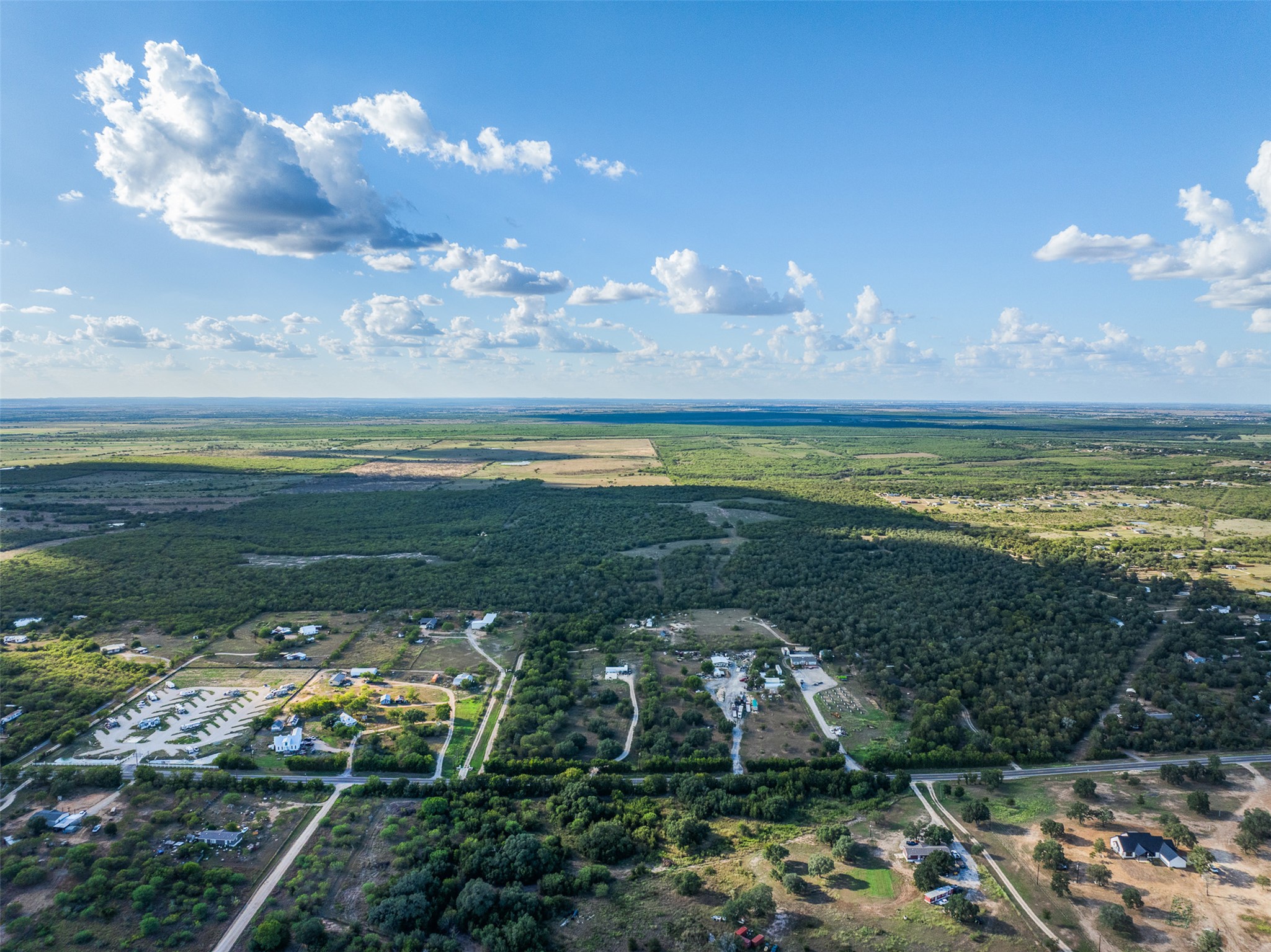 399 Seals Creek Road Lockhart, TX 78644 - Photo 3 of 40 View of property location featuring a forest
