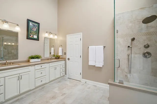a living room with furniture a chandelier and a rug