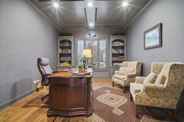 a spacious bedroom with a bed and a flat screen tv