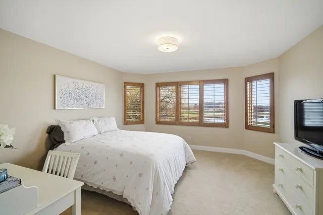 a bedroom with bed and window