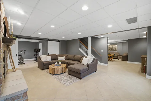 a spacious bedroom with a bed and window