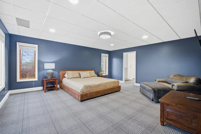 a spacious bathroom with a double vanity sink and a mirror
