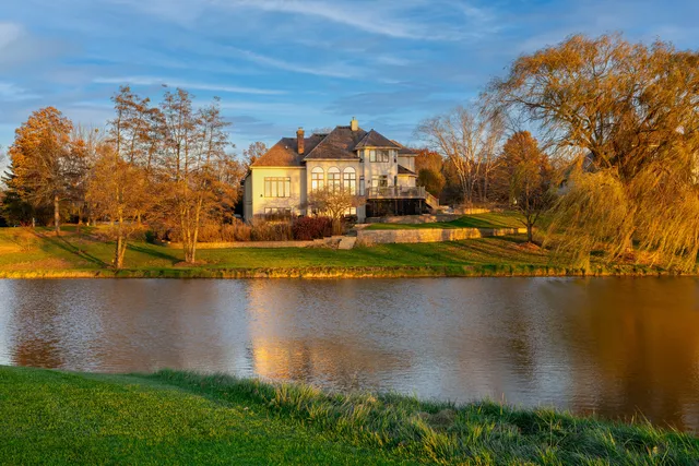 a view of a lake with a house in the background