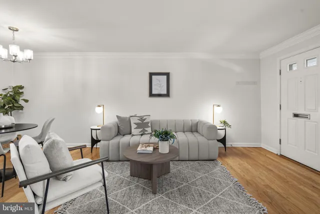 a living room with furniture and a table
