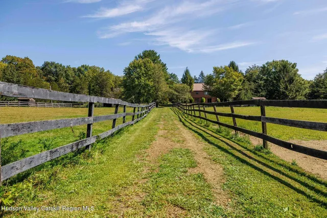 a view of a swimming pool with a yard