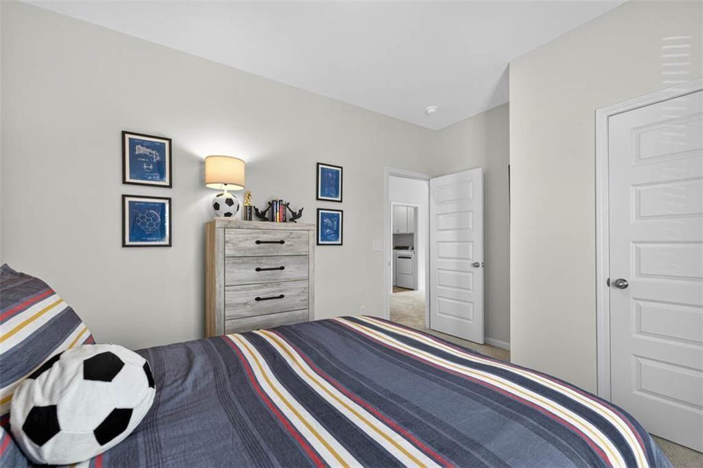 532 Guy Williams Road Rock Spring, GA 30739 - Photo 21 of 42 a view of a bedroom with bed and cabinet