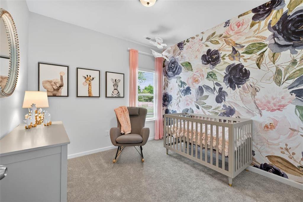 532 Guy Williams Road Rock Spring, GA 30739 - Photo 23 of 42 a bedroom with a bed and chair