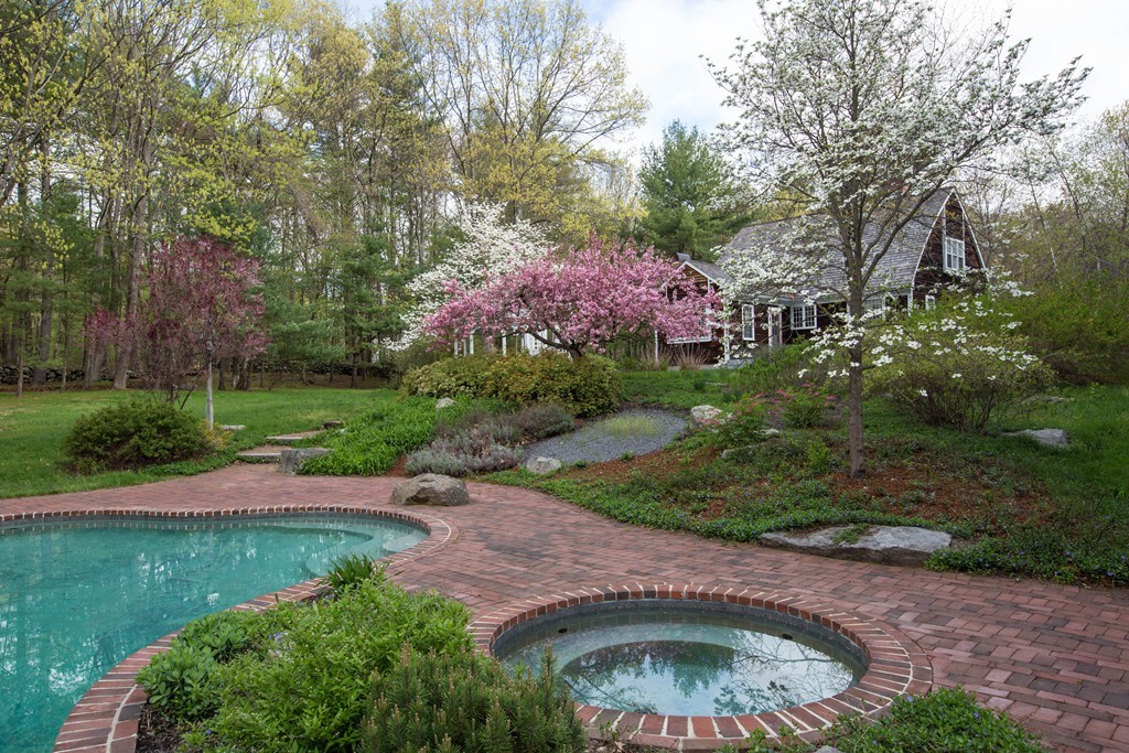 32 Century Mill Road Bolton, MA 01740 - Photo 1 of 27 a view of a garden with a fountain and large trees