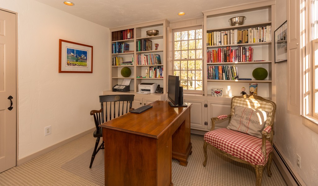 32 Century Mill Road Bolton, MA 01740 - Photo 20 of 27 a view of a workspace with furniture and a book shelf