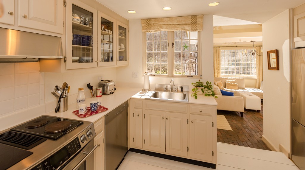 32 Century Mill Road Bolton, MA 01740 - Photo 8 of 27 a kitchen with a sink stove and cabinets