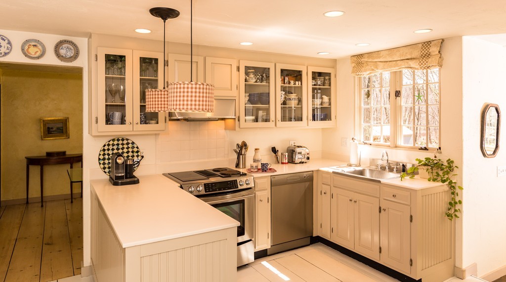 32 Century Mill Road Bolton, MA 01740 - Photo 9 of 27 a kitchen with a sink stove and cabinets