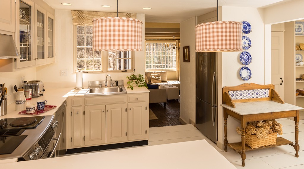 32 Century Mill Road Bolton, MA 01740 - Photo 10 of 27 a kitchen with a refrigerator and a sink