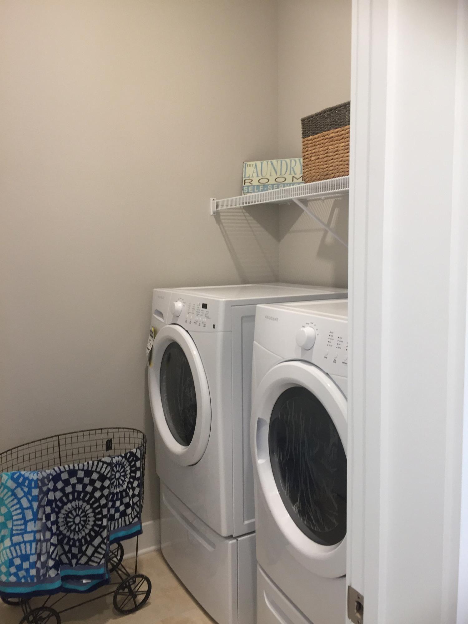 88 Pine Lands Loop Inlet Beach, Unit E A Inlet Beach, FL 32461 - Photo 5 of 11 a utility room with dryer and washer