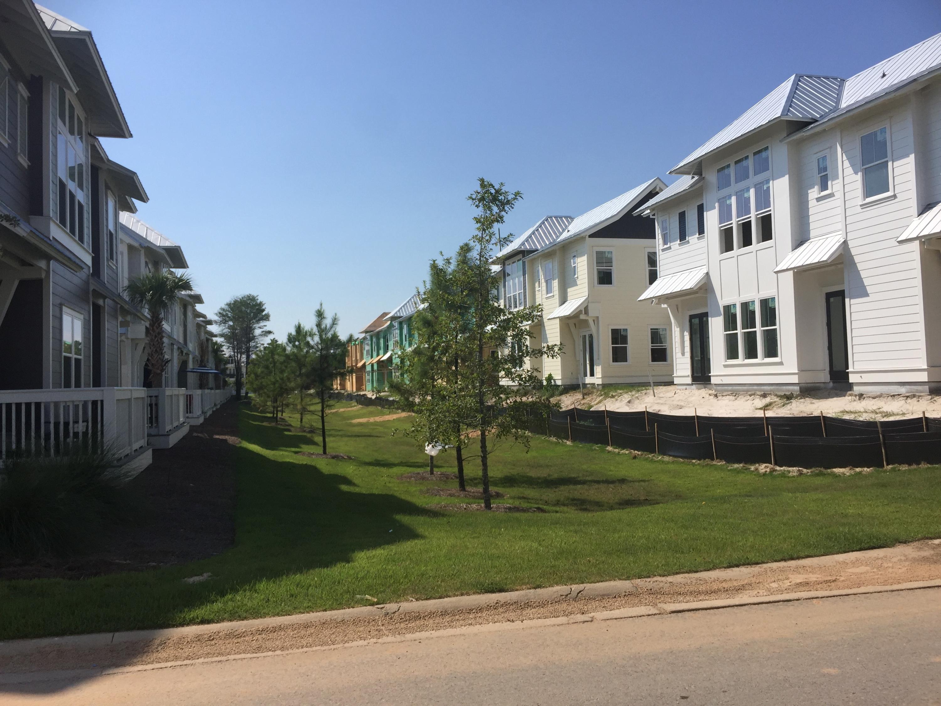 88 Pine Lands Loop Inlet Beach, Unit E A Inlet Beach, FL 32461 - Photo 6 of 11 a front view of a house with a yard