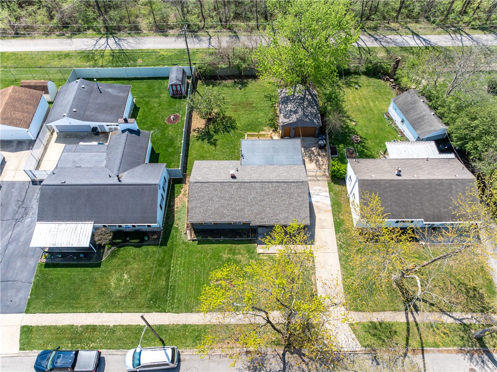 5240 Haverfield Road Dayton, OH 45432 - Photo 56 of 58 An aerial perspective showcases a residential neighborhood with well-maintained homes and verdant yards.