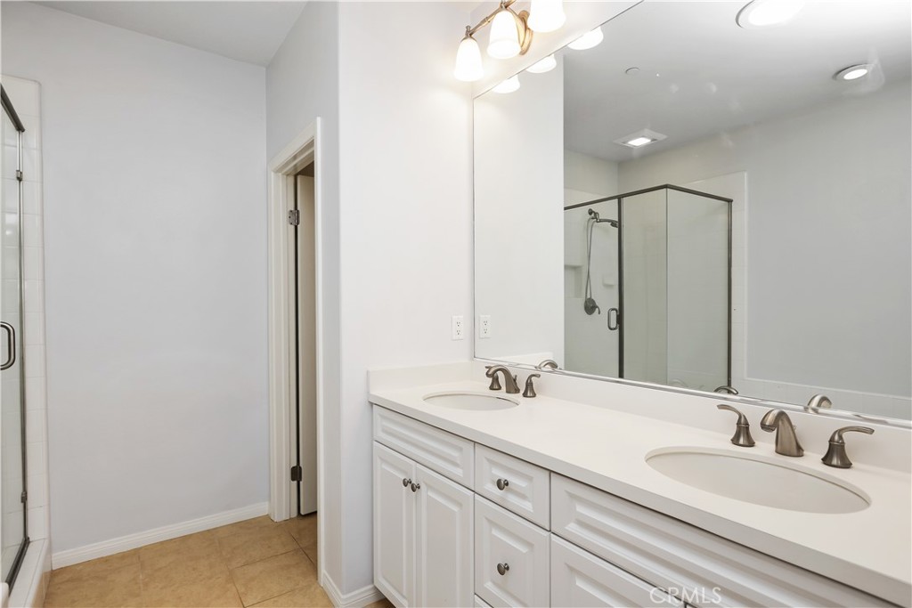 10 Nature Irvine, CA 92620 - Photo 15 of 27 a bathroom with 2 sink and a mirror