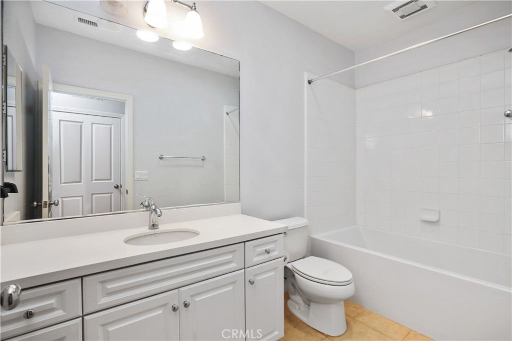 10 Nature Irvine, CA 92620 - Photo 18 of 27 a bathroom with a sink a toilet and shower