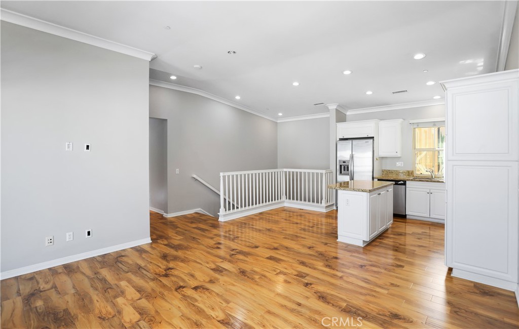 10 Nature Irvine, CA 92620 - Photo 4 of 27 a view of kitchen with wooden floor